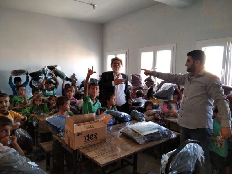 Suriye’deki bin Doğu Türkistanlı çocuğa mont ve bot
