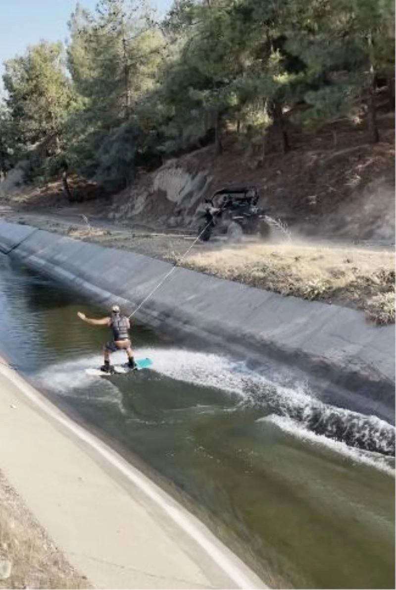 Sulama kanalında ATV ile sörf yaptı
